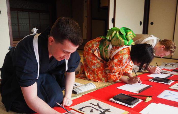 People writing calligraphy